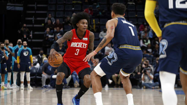 Nov 15, 2021; Memphis, Tennessee, USA; Houston Rockets guard/forward Kevin Porter Jr. (3) dribbles as Memphis Grizzles guard Kyle Anderson (1) defends during the first half at FedExForum. Mandatory Credit: Petre Thomas-USA TODAY Sports